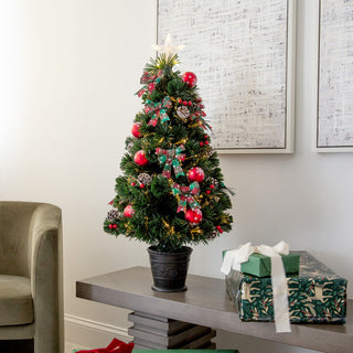 Lifestyle image showing the full tree in a real room setting.