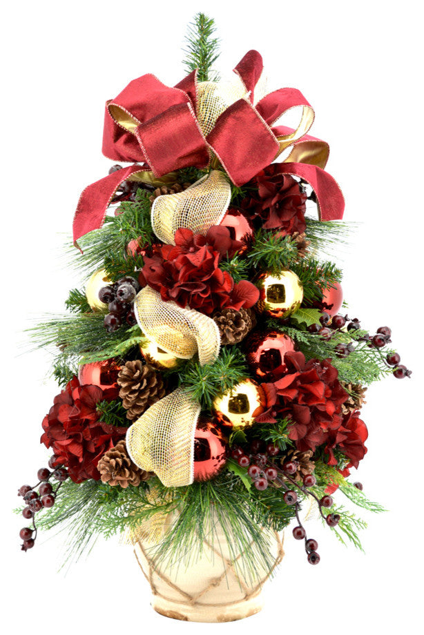 Burgundy hydrangea and berry decorated evergreen tree in ceramic pot