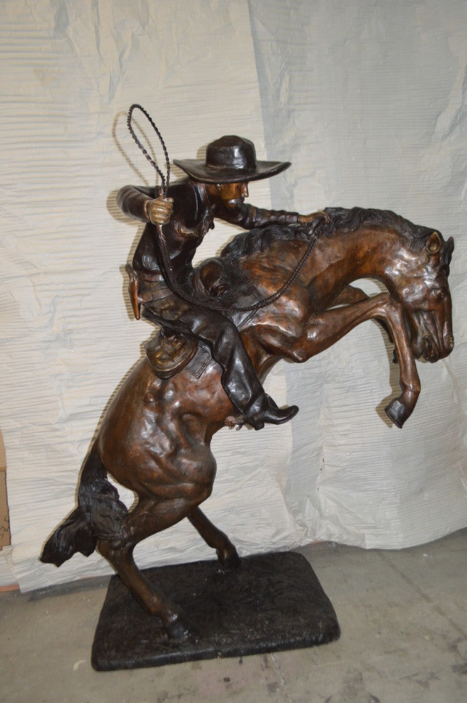 Bronco Buster Giant Bronze Statue -  Size: 65"L x 52"W x 64"H.