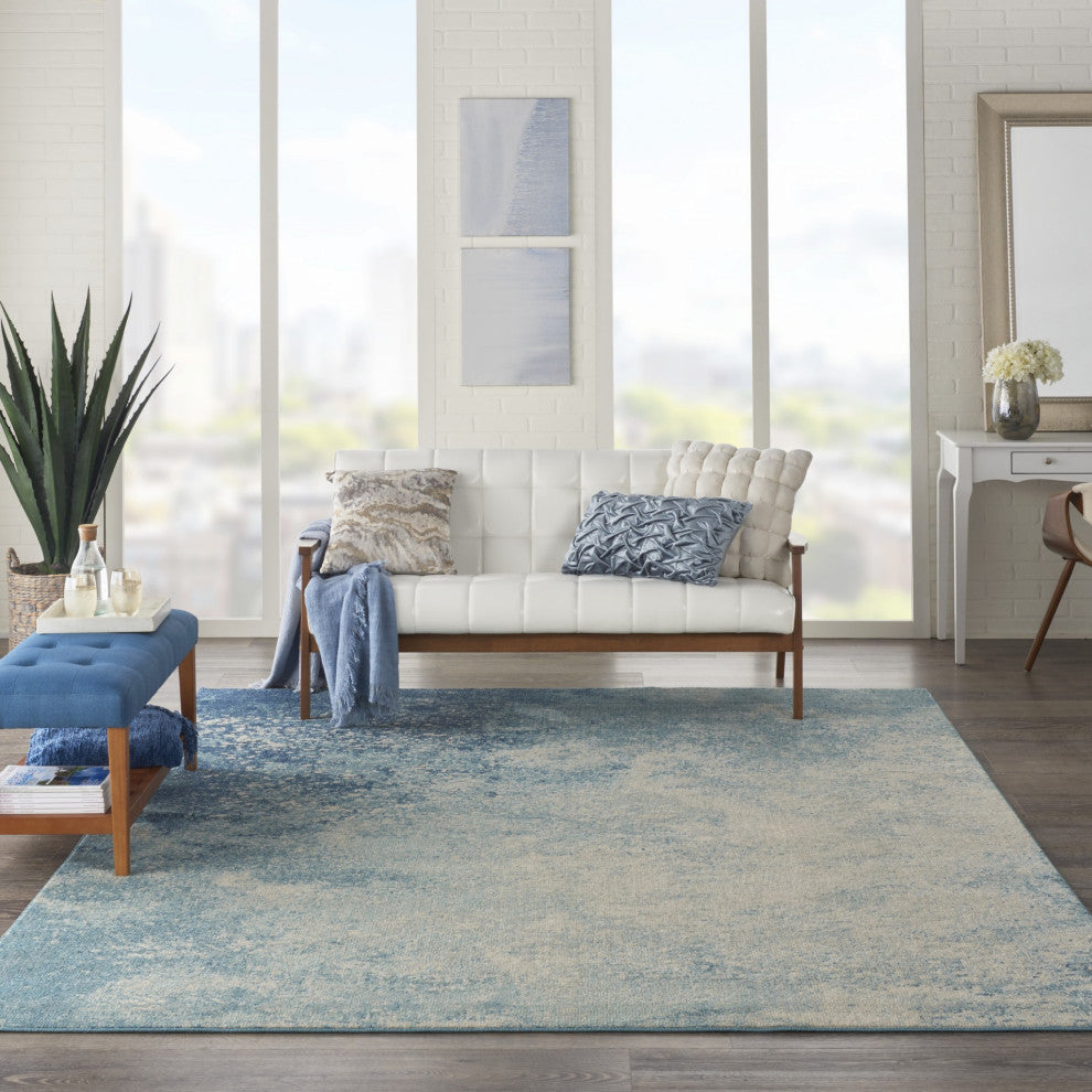 7' X 10' Ivory And Blue Abstract Power Loom Area Rug