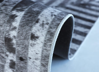 Faux Cowhide Patchwork Caught, the Crosshairs 6'x 9' Area Rug