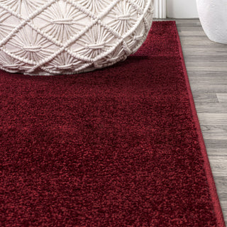 Haze Solid Low-Pile Dark Red 6 ft. x 9 ft. Oval Area Rug