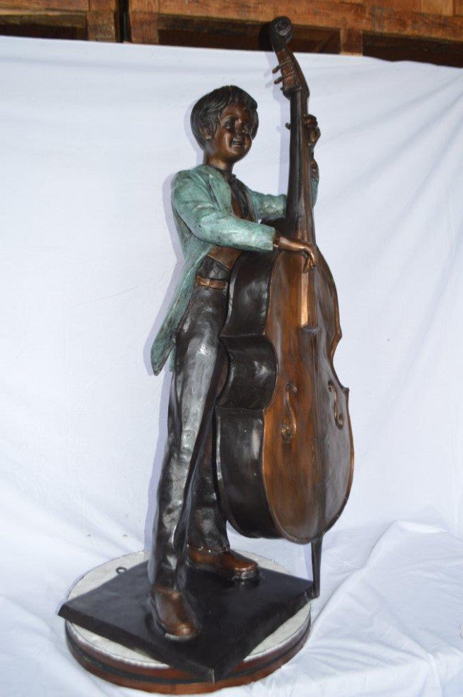 Boy playing cello large bronze statue -  Size: 19"L x 22"W x 59"H.