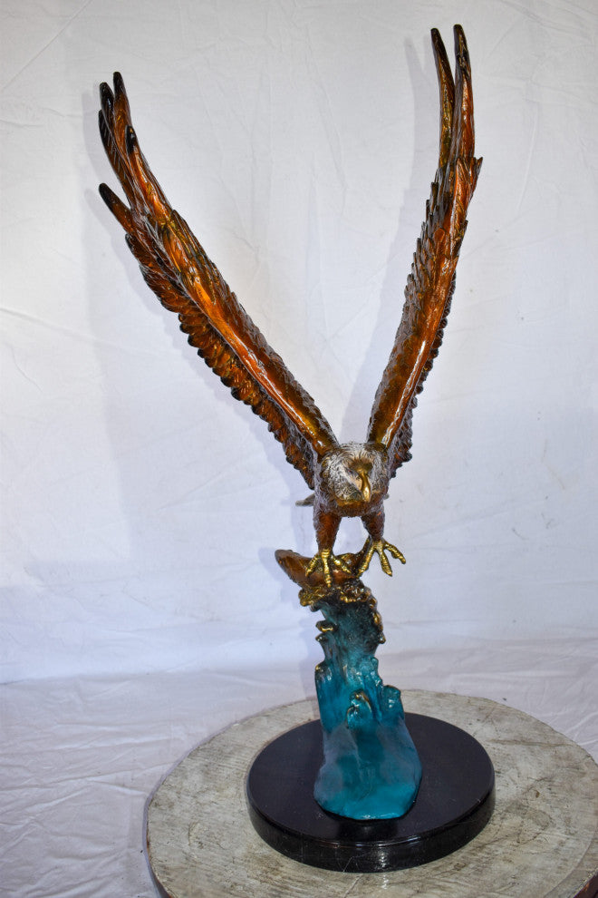 Eagle In Action Catching a Fish from Water Bronze Statue Size: 18" x 17" x 37"