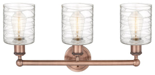 Edison Cobbleskill-3 Lt 23"Bath Vanity Lt-Antique Copper Finish-Deco Swirl Shade