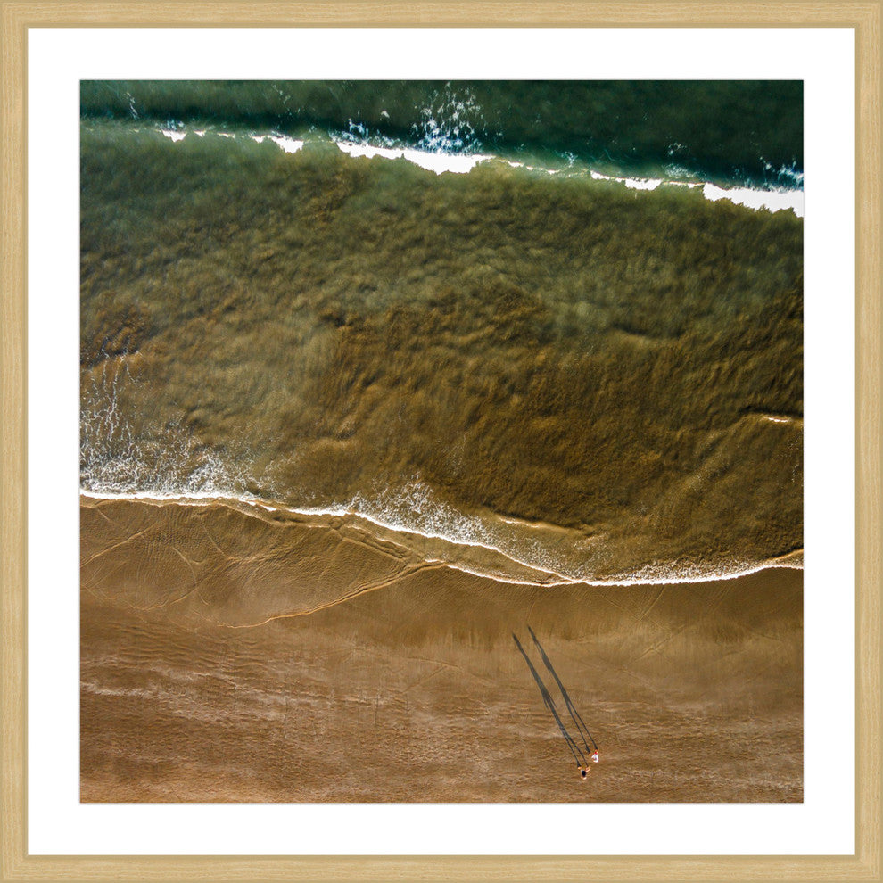 "Walking The Shore" Framed Print by Karolis Janulis