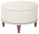 Alloway Faux Leather Storage Ottoman With Antique Bronze Nailheads, Cream