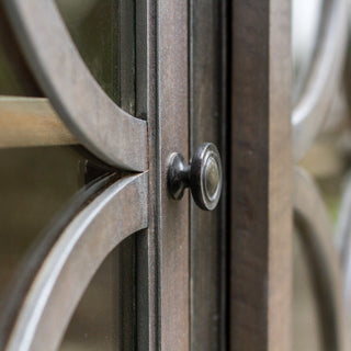 Close-up of a hardware/feature (door knob and lattice detail) on a lifestyle background.