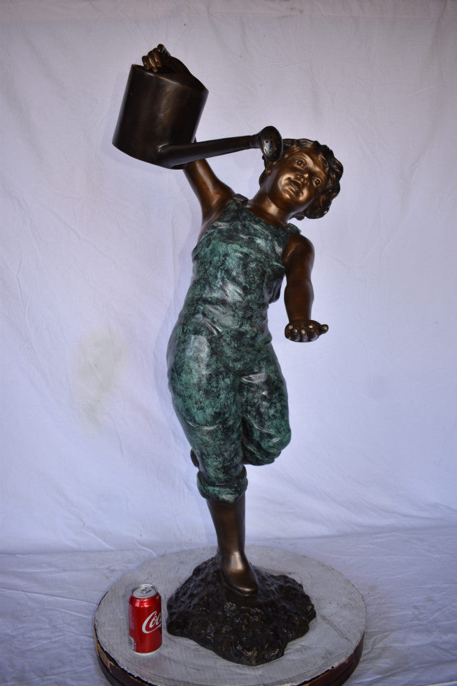 Standing Boy With Watering Can Bronze Statue Size: 15"L x 15"W x 39"H.