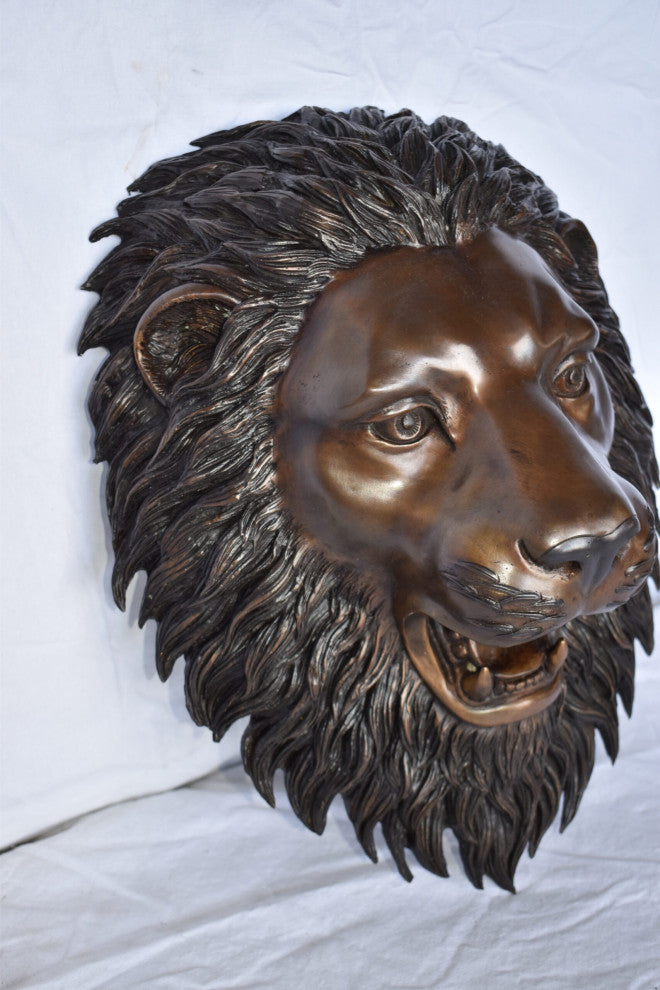 Wall Mounted Lion Face Fountain Made of Bronze Size: 12"L x 8"W x 18"H.