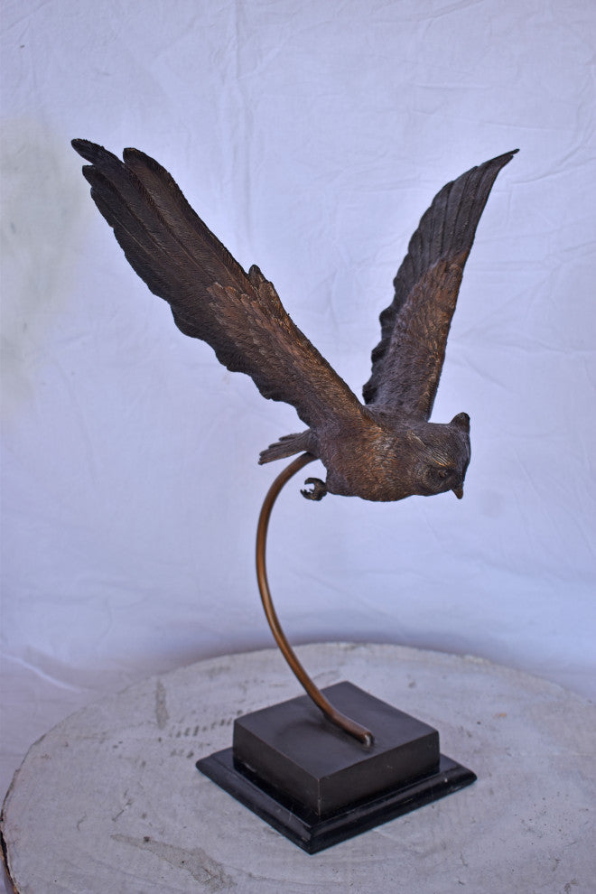 Owl Searching for Prey Bronze Statue Size: 18"L x 11"W x 22"H.
