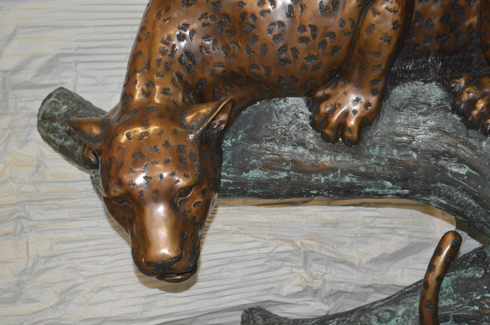 Leopard on a Tree Trunk Bronze Statue -  Size: 38"L x 34"W x 36"H.