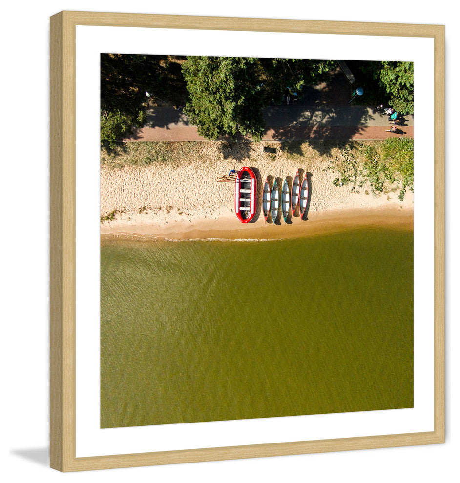 "Boats In A Row" Framed Print by Karolis Janulis