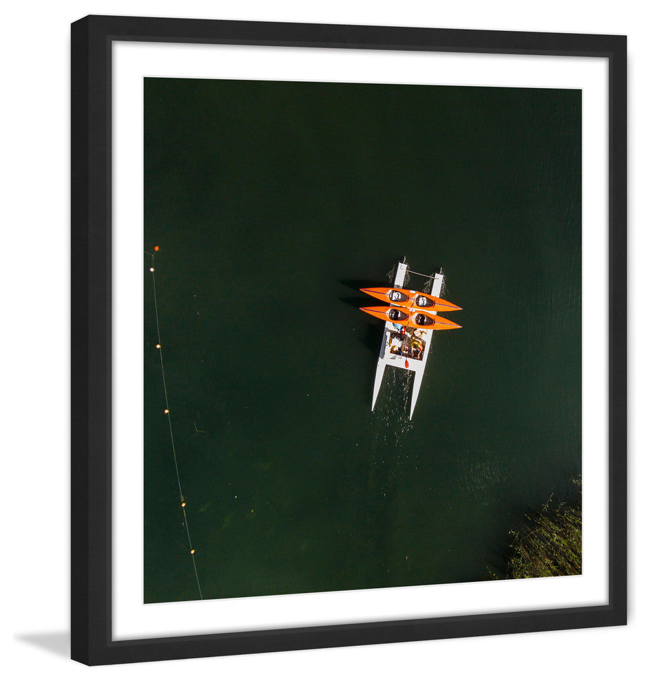 "Orange Kayaks" Framed Print by Karolis Janulis