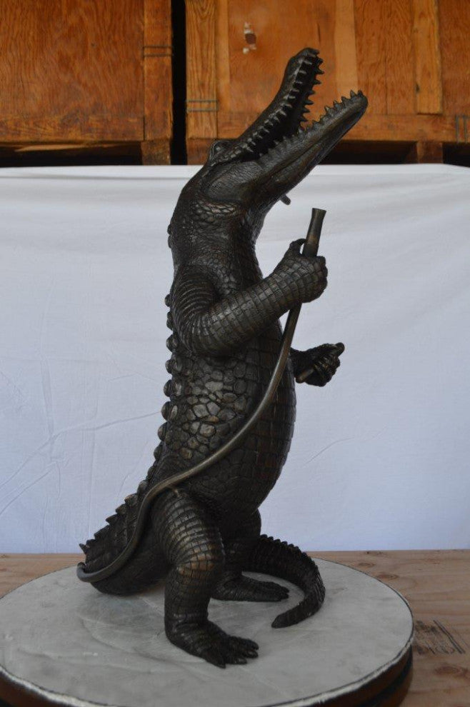 Alligator having fun bronze statue - fountain -  Size: 15"L x 15"W x 31"H.
