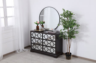Lifestyle shot in a real room with decor; full cabinet visible.