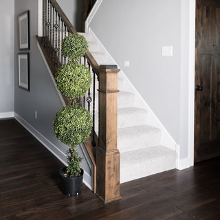 Lifestyle image showing the full triple-ball topiary in a real home environment.