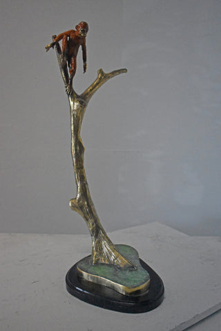 Colored Monkey Resting on a Tree Bronze Statue - Size: 12"L x 13"W x 27"H.