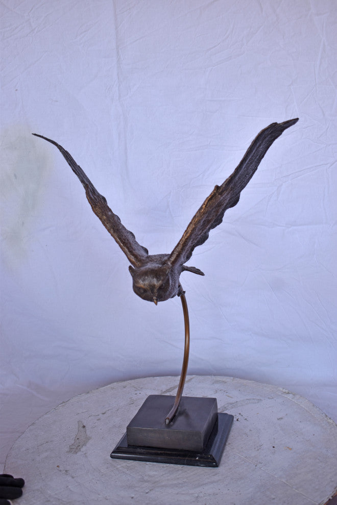 Owl Searching for Prey Bronze Statue Size: 18"L x 11"W x 22"H.