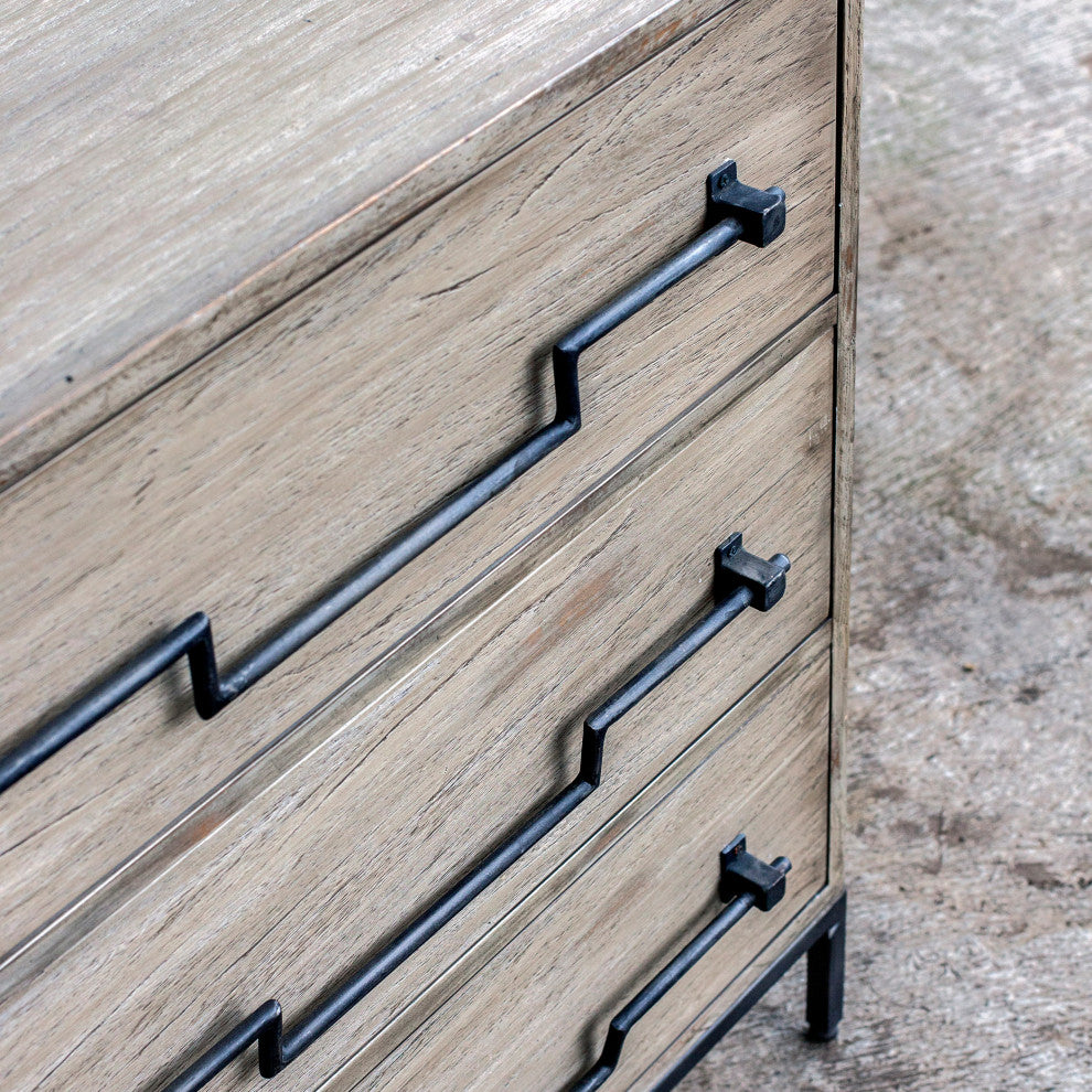 Close-up of drawer handle on a lifestyle background (outdoor/earthy setting).
