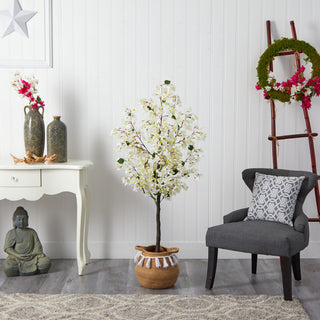 Tree shown in a real room setting with decor; complete product visible.