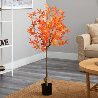 Lifestyle image showing the orange maple tree in a living room; full product visible; non-white background.
