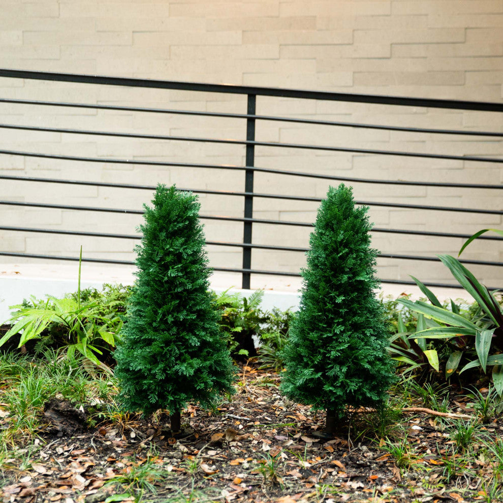 Lifestyle photo showing product in outdoor setting; full trees visible.