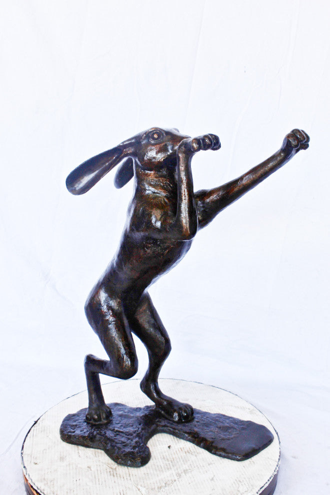 Leaping jackrabbit bronze statue -  Size: 21"L x 13"W x 24"H.