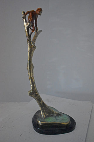 Colored Monkey Resting on a Tree Bronze Statue - Size: 12"L x 13"W x 27"H.