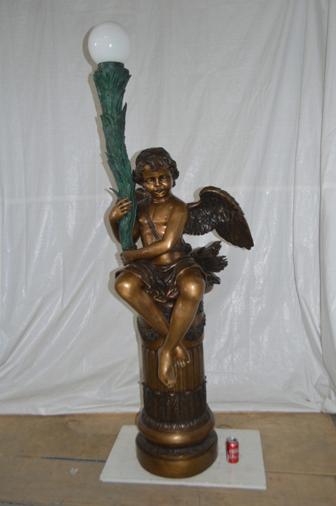 Pair of Cupid on stand lamp -  Size: 28"L x 24"W x 90"H.