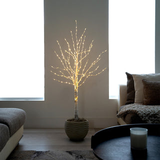 Lifestyle shot showing the tree in a living-room setting.