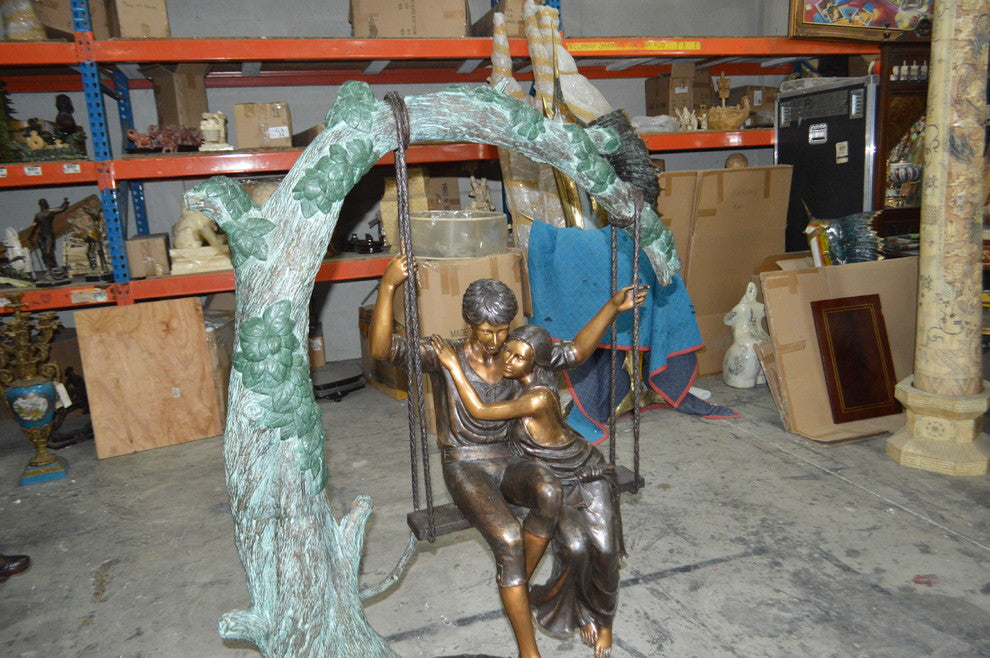 Lovers on a Swing Bronze Statue -  Size: 48"L x 32"W x 64"H.