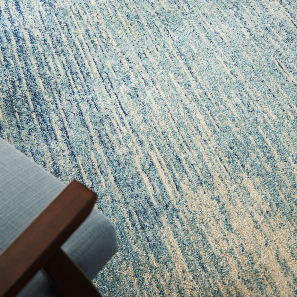 5' X 7' Ivory And Blue Abstract Stripes Power Loom Area Rug