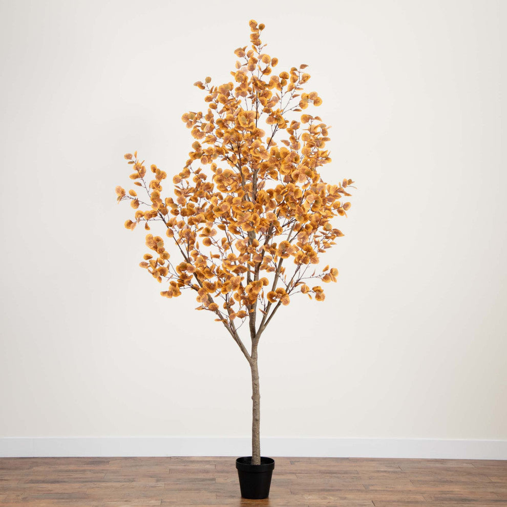 Lifestyle image showing the tree in a real room with neutral wall; product clearly visible.