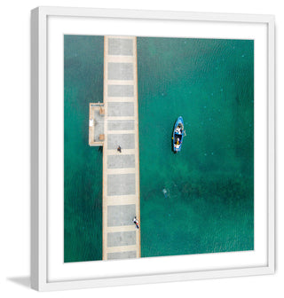 "Blue Boat Floats" Framed Print by Karolis Janulis