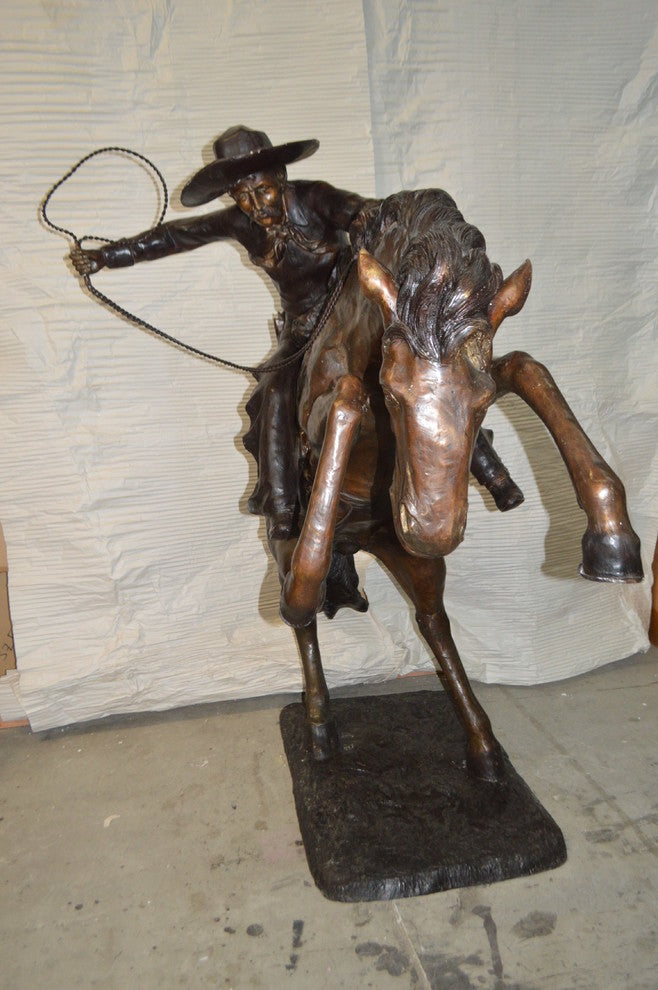 Bronco Buster Giant Bronze Statue -  Size: 65"L x 52"W x 64"H.