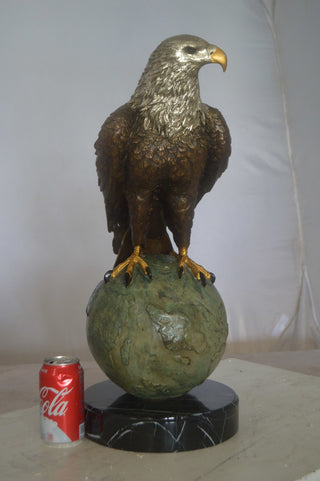 Bald Eagle Standing on a Globe Bronze Statue -  Size: 17"L x 9"W x 23"H.