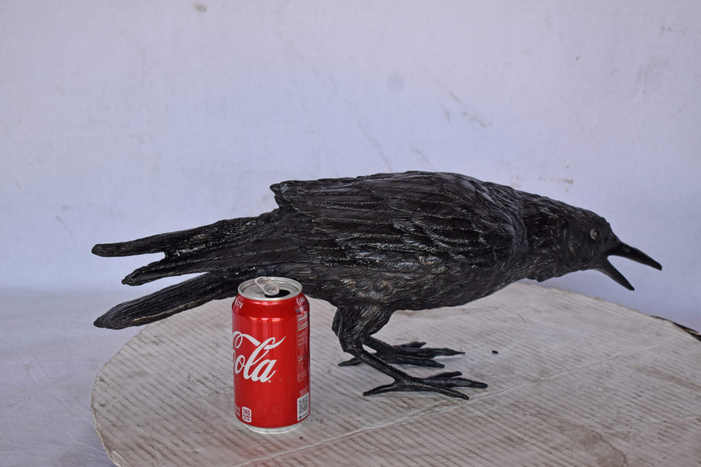 Raven Looking for Food Bronze State - Size: 24"L x 6"W x 12"H.