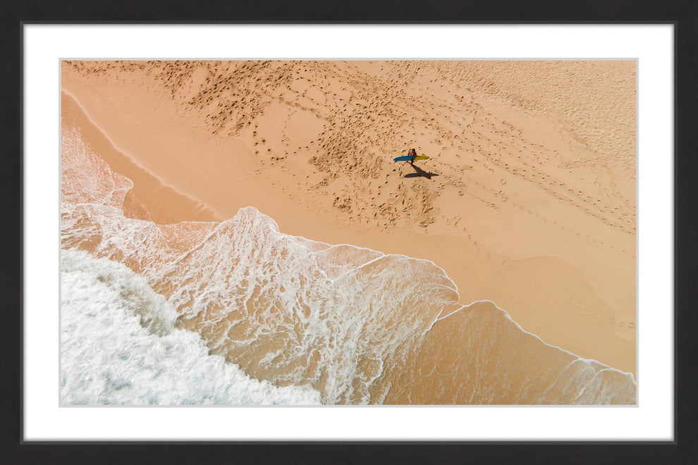 "Lapping The Sand" Framed Print by Karolis Janulis