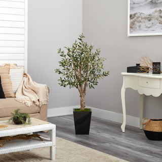 Lifestyle image: product shown in a real living room environment; not on white background; full tree visible.