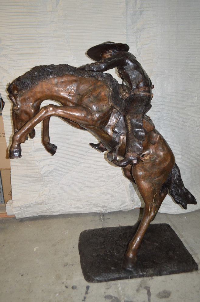 Bronco Buster Giant Bronze Statue -  Size: 65"L x 52"W x 64"H.