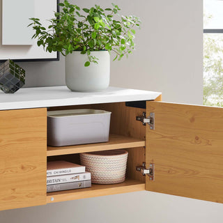 Lifestyle setting in a room with plant and countertop; product visible in real environment.
