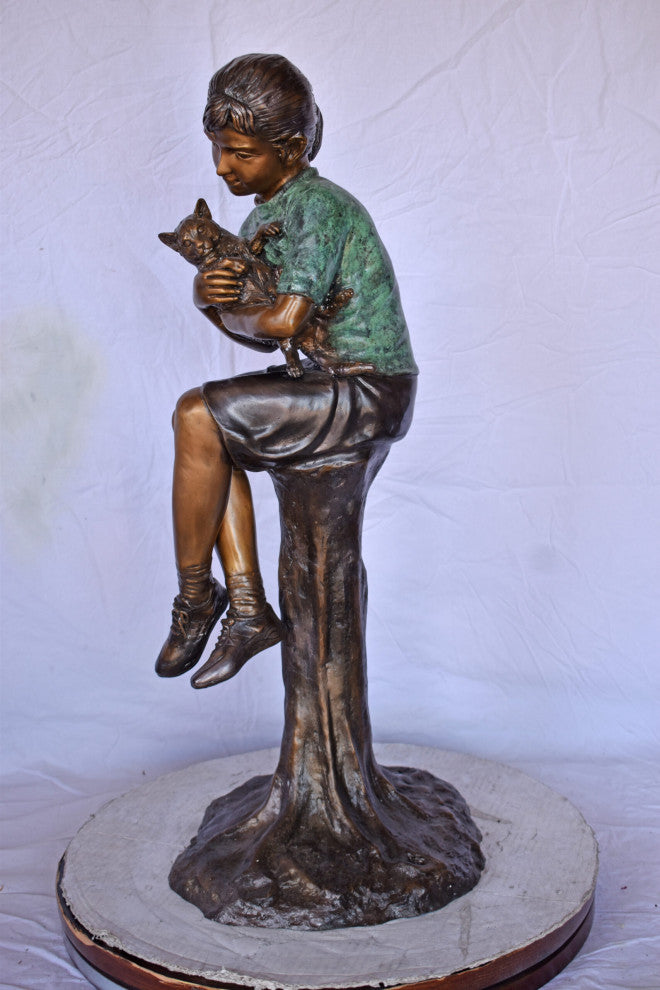 Girl Sitting on A Log With Her Cat Bronze Statue Size: 15"L x 15"W x 35"H.
