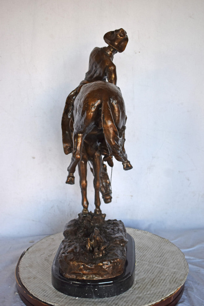 Outlaw by Remington Bronze Statue Replica - Size: 18"L x 10"W x 32"H.
