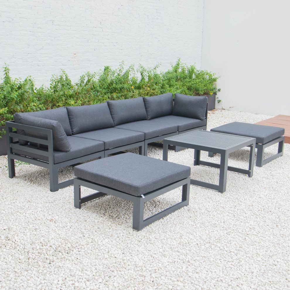 LeisureMod Chelsea 7-Piece Patio Ottoman Sectional With Coffee Table, Black