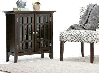 Lifestyle shot: product shown in a real room environment with rug and chair.