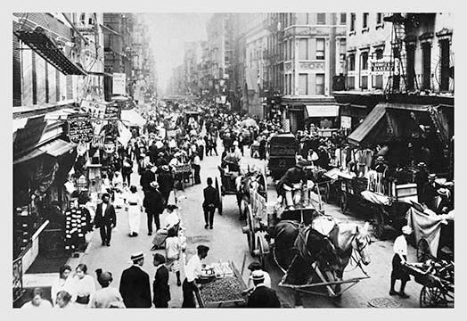 People, Peddlers, and Horse-Drawn Carriages on a Lower East Side Street