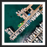 "Neatly Docked Boats" Framed Print by Karolis Janulis