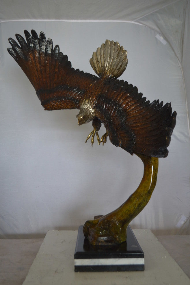 Eagle Soaring Bronze Statue by W Aribu -  Size: 35"L x 27"W x 38"H.