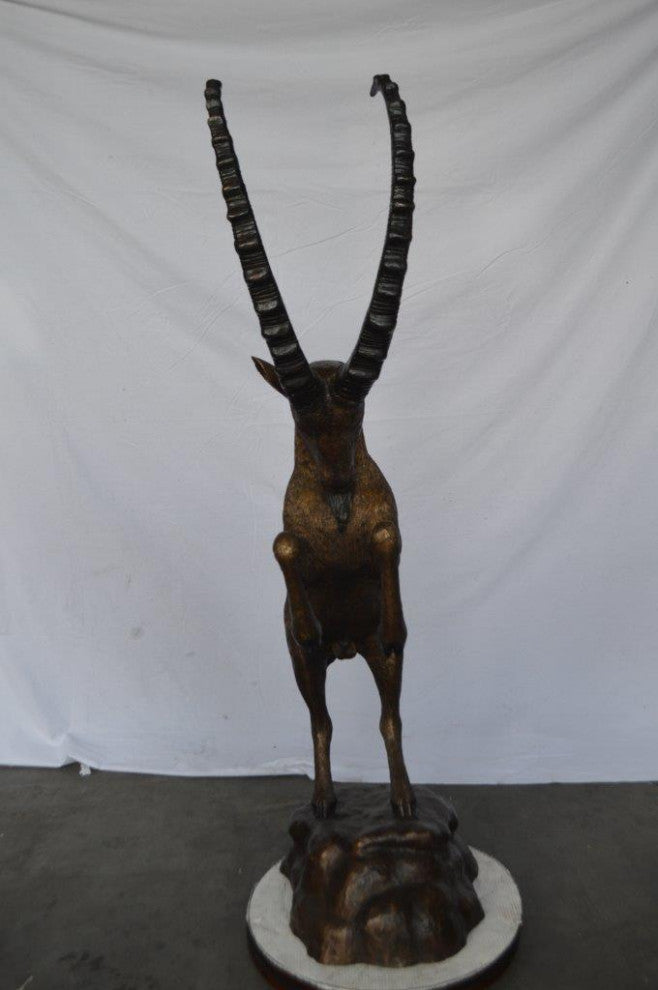Mountain goat on hind legs bronze statue -  Size: 36"L x 16"W x 66"H.